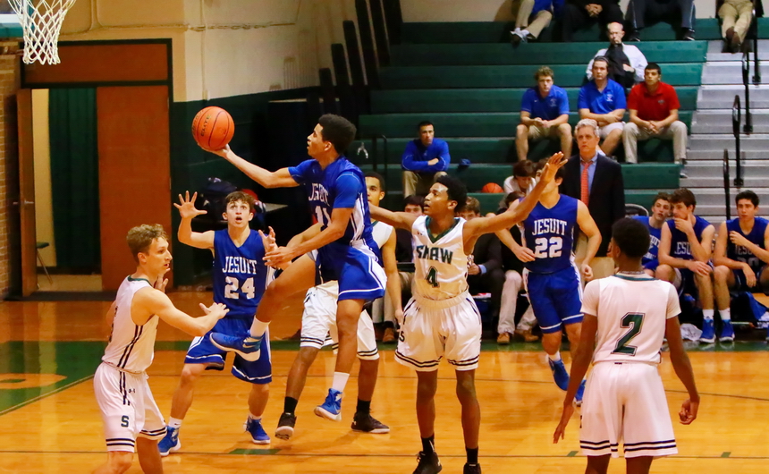 Michael Hull weaves his way through the lane to score this lay up in the fourth quarter of Jesuit's 55-50 win over Archbishop Shaw on Friday evening, Jan. 15, at the Eagles' gym on the West Bank.