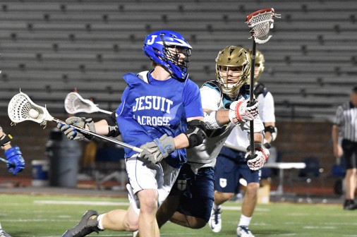 Junior Noah Martin evades a Jesuit College Prep defender.