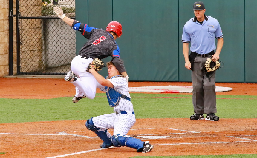Catcher Josh Schmidt has the ball in his glove and stands his ground as this Chief runner tries to extend a triple into a home run. It was an unwise attempt as Schmidt put the mighty tag on him, an easy out call for the home plate umpire.