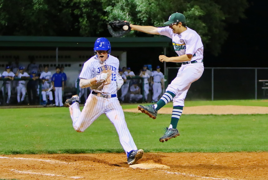 Nick Ray runs hard after hitting an infield chopper. He was safe as the throw to first base was high, pulling the Eagle off the bag,