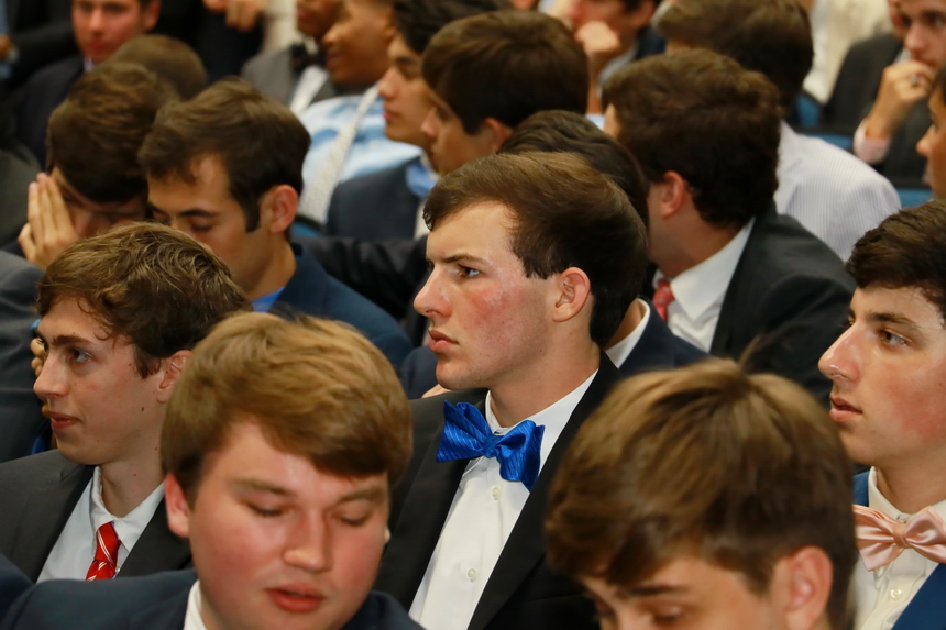 Connor Maheu with his fellow graduates in the Jesuit auditorium prior to the Baccalaureate Mass for the Class of 2016.