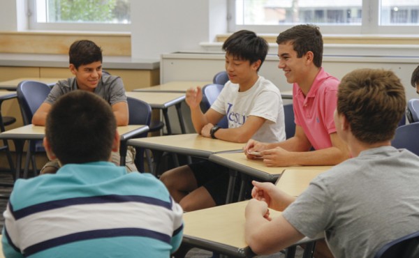 Senior Rick Gogreve helps his small group discuss their friendships.