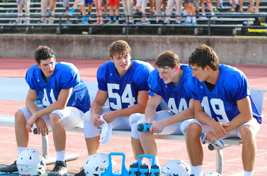 Taking a break during the McDonogh 35 scrimmage are key senior players on Jesuit's defense, from left, defensive back Matt McMahon (41), linebackers Cameron Crozier (54) and Jacob Baxter (44), and defensive back Patrick Spiers (19).