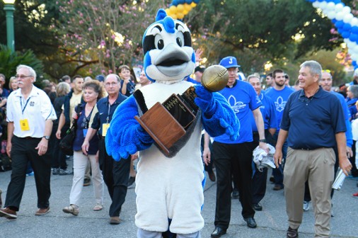 Jayson displays the Golden Football trophy, which Jesuit hopes to reclaim this year.