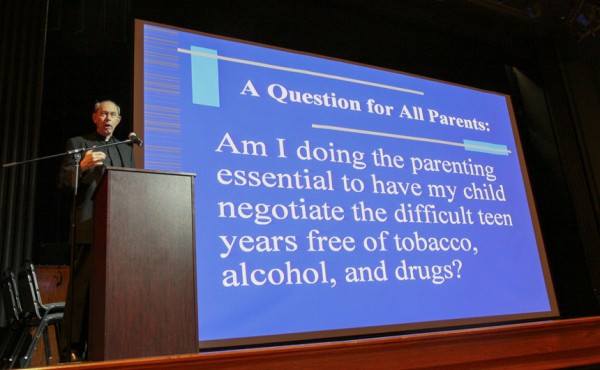 Fr. McGinn speaks at a past town hall meeting.
