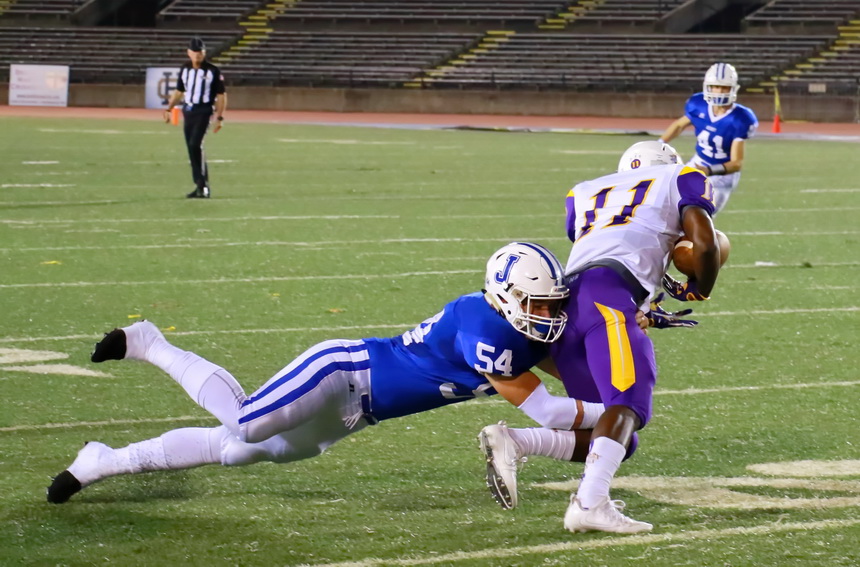 Cameron Crozier takes down a Demon, one of his eight tackles in the game. Crozier also blocked a punt, picked up the ball, and ran it to inside the 1-yard line.