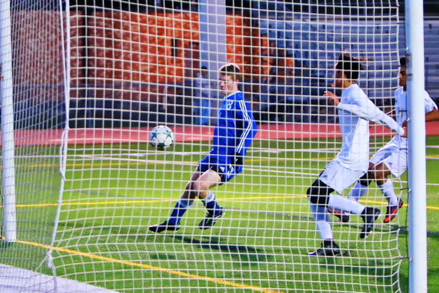 After Ashton Perkins (18) scored in the third minute, there were plenty of chances for Jesuit to kill the game. In this photo, the ball ricochets off the post and gets past Perkins, who can't quite put his foot into stuffing it.