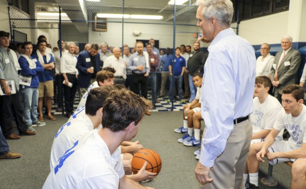 Former Blue Jay players hit the locker room for the pre-game talk led by head coach Chris Jennings.