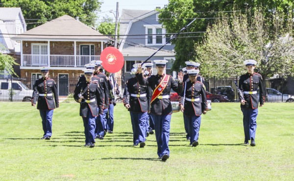 The MCJROTC band takes the field.