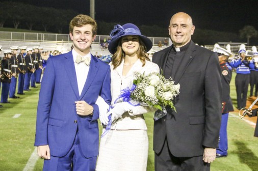 Before the big announcement, Rev. Christopher Fronk, S.J. greets the first senior couple of Ben Brodnax and Abby Haydel (St. Mary's Dominican).