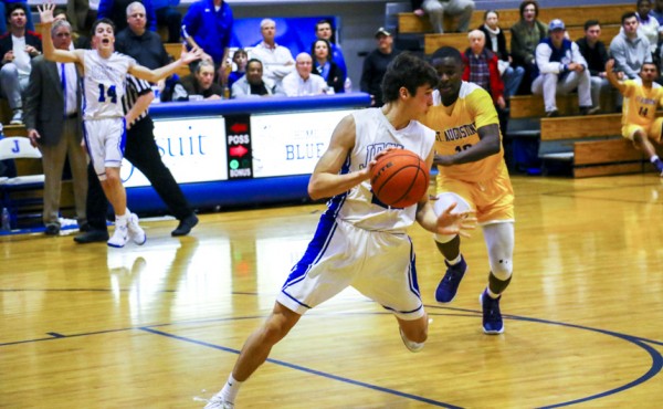 FINAL PLAY! Robert McMahon, who also plays wide receiver for the Blue Jay football team, catches a long bomb from DeBlieux with two seconds left. The clock would tick to zero as McMahon avoided a foul or a turnover.