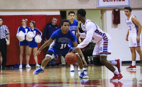 Michael Hull locks down the Rummel point guard.