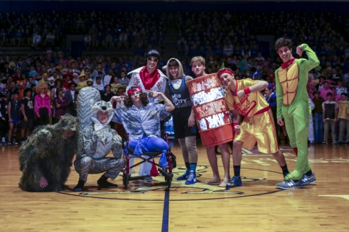 Wrestling seniors at half-court. (From left, bottom) Kelly Zeringue, Adam Larriviere, Jack Ehrhardt, (standing) Andrew Fugetta, Evan Queyrouze, Eli Larriviere, Nate Koenig, and Tom Arseneaux