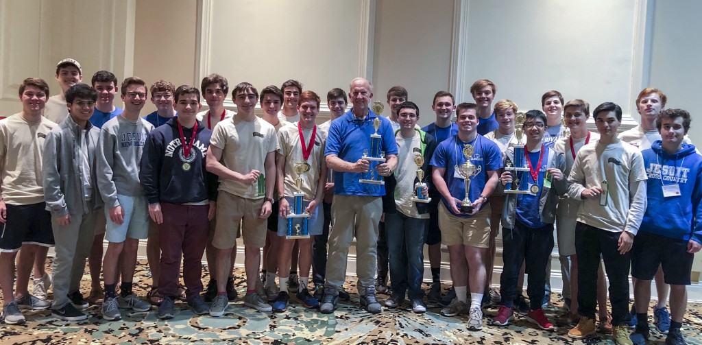 Legendary Jesuit math teacher, Mr. David Wright, poses with Calculus students and senior Analysis students.