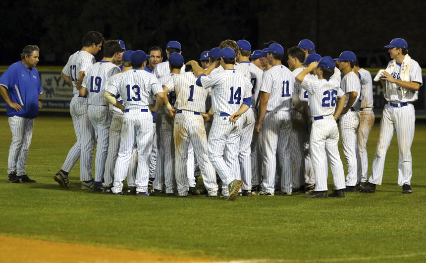 Head coach Kenny Goodlett meets with the team after its heartbreaking loss in Game 3 at St. Paul's