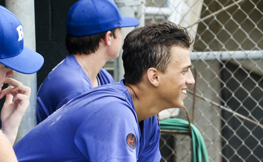 Sean Seghers '18 smiles in the dugout after his 6th-inning grand slam that lifted Retif from a tied game to a 9-5 lead.