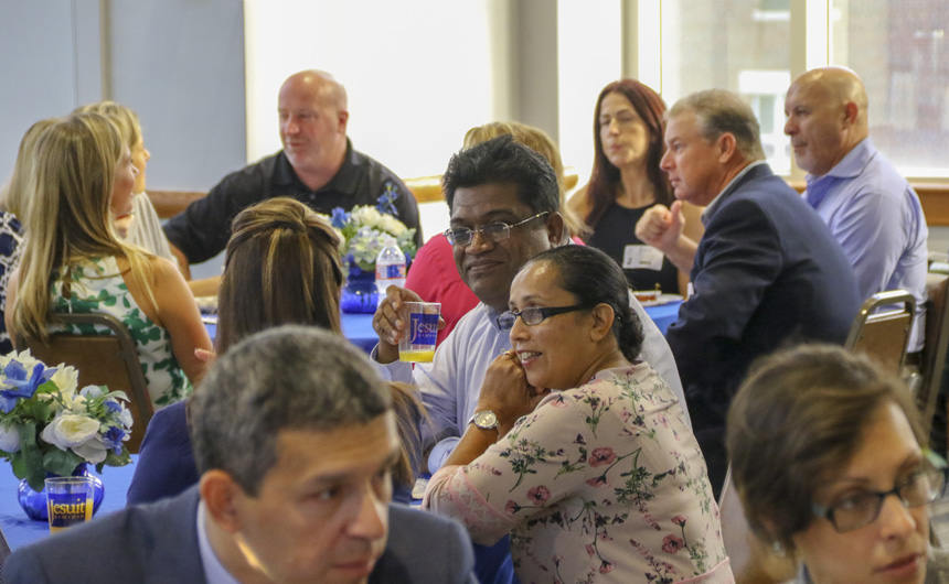 Christus and Thushari Fernando, parents of a Class of 2017 graduate and a current pre-freshmen, enjoy another Breakfast as they restart their journey as Jesuit parents.